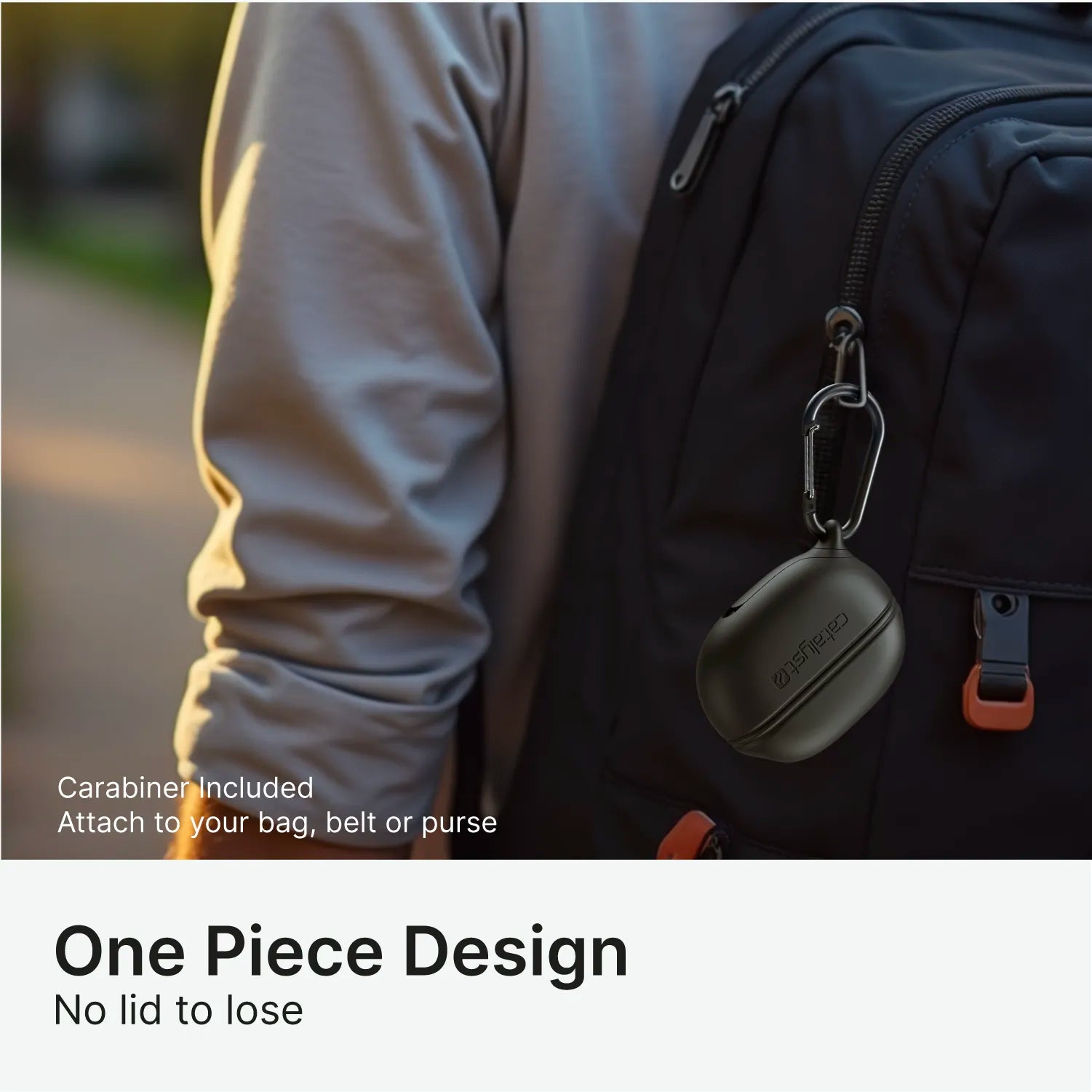 Outdoors, a person in a grey shirt carries a black backpack with the Catalyst Case US Waterproof Case + Carabiner for Beats Studio Buds/Studio Buds Plus—featuring an included carabiner to easily attach and a one-piece, lidless design.