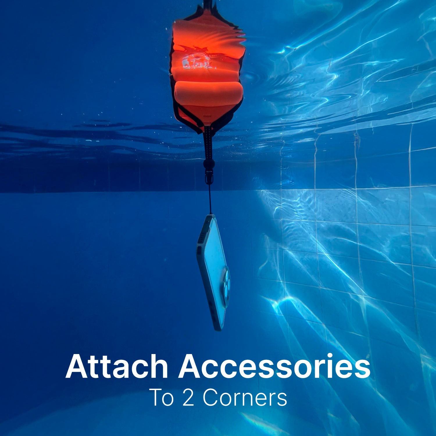 The Catalyst Waterproof case for iPhone in black features a fully sealed design and comes with Floating Wrist Lanyard. Text on the case reads, "Attach Accessories to 2 Corners." Perfect for capturing underwater moments.