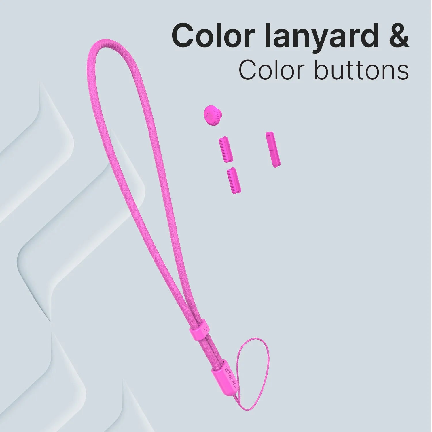 A bright pink Catalyst Case US Colored Lanyard & Buttons set is shown on a light blue geometric background. "Colored Lanyard & Buttons" appears in bold and regular black font in the upper right corner.
