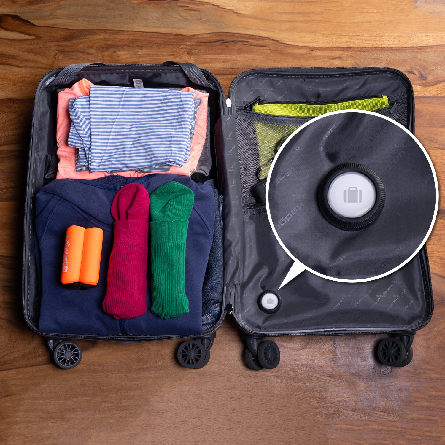 Catalyst airtag total protection case stick it showing the case attached to a luggage bag