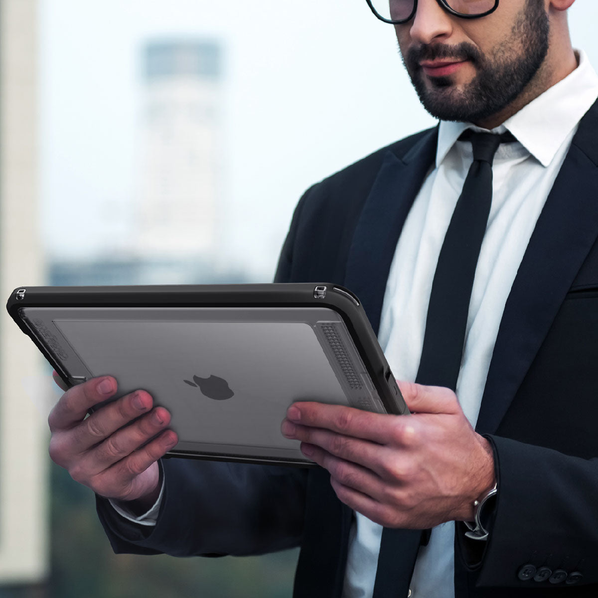 catalyst ipad air gen 3 10.5 waterproof case stealth black man in formal attire with an ipad