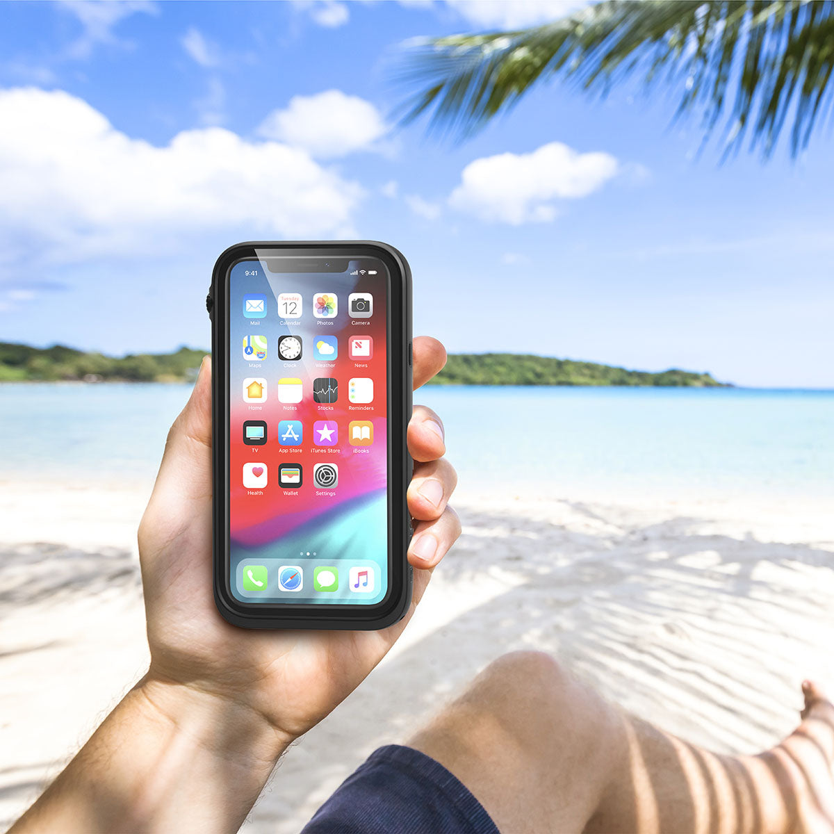Catalyst iphone x/xr/xs/xs max waterproof case xr showing the man holding the phone with a case in stealth black