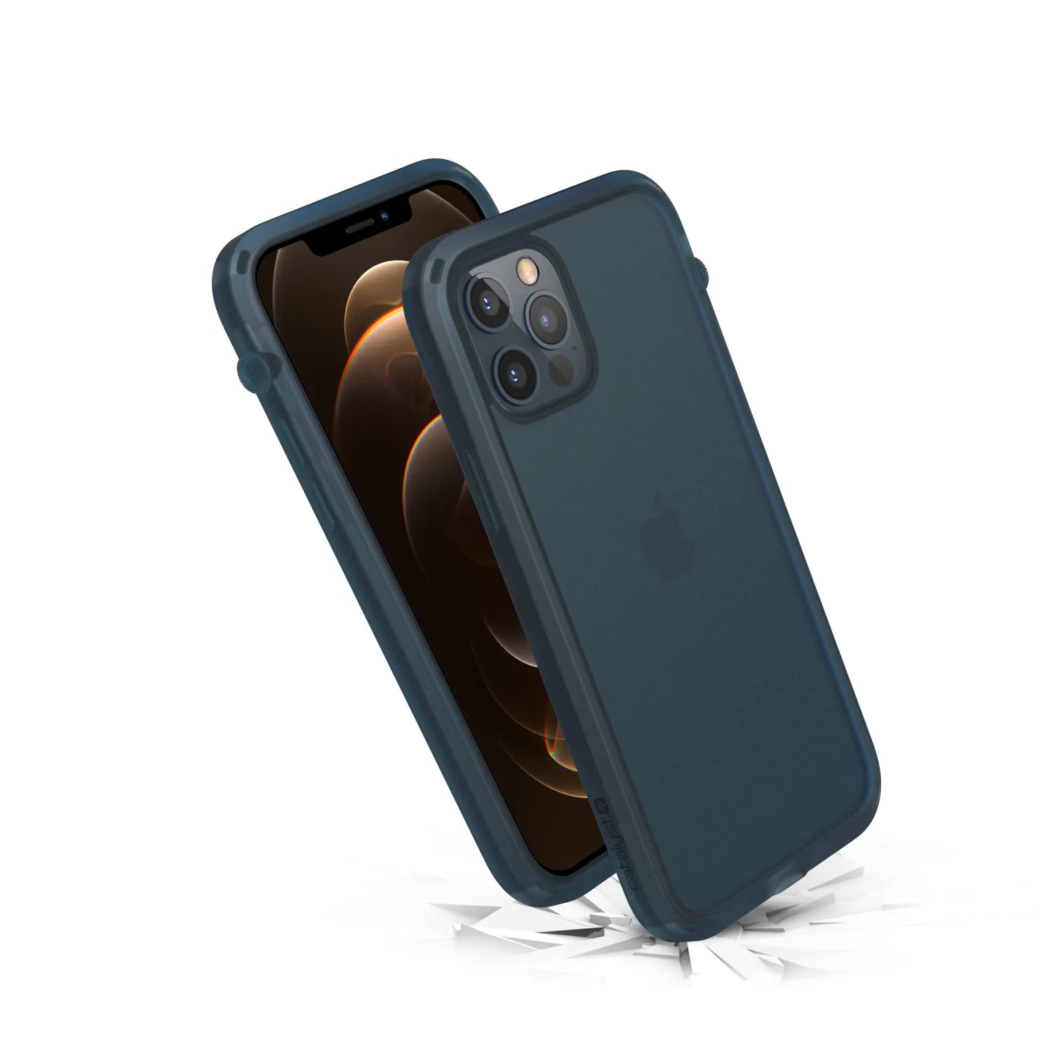 The Catalyst Case US Influence Case for iPhone 12 / 12 Pro is shown upright (front and back) in dark blue. Surrounded by shards on a white background, it highlights drop-proof impact resistance and supports wireless charging.