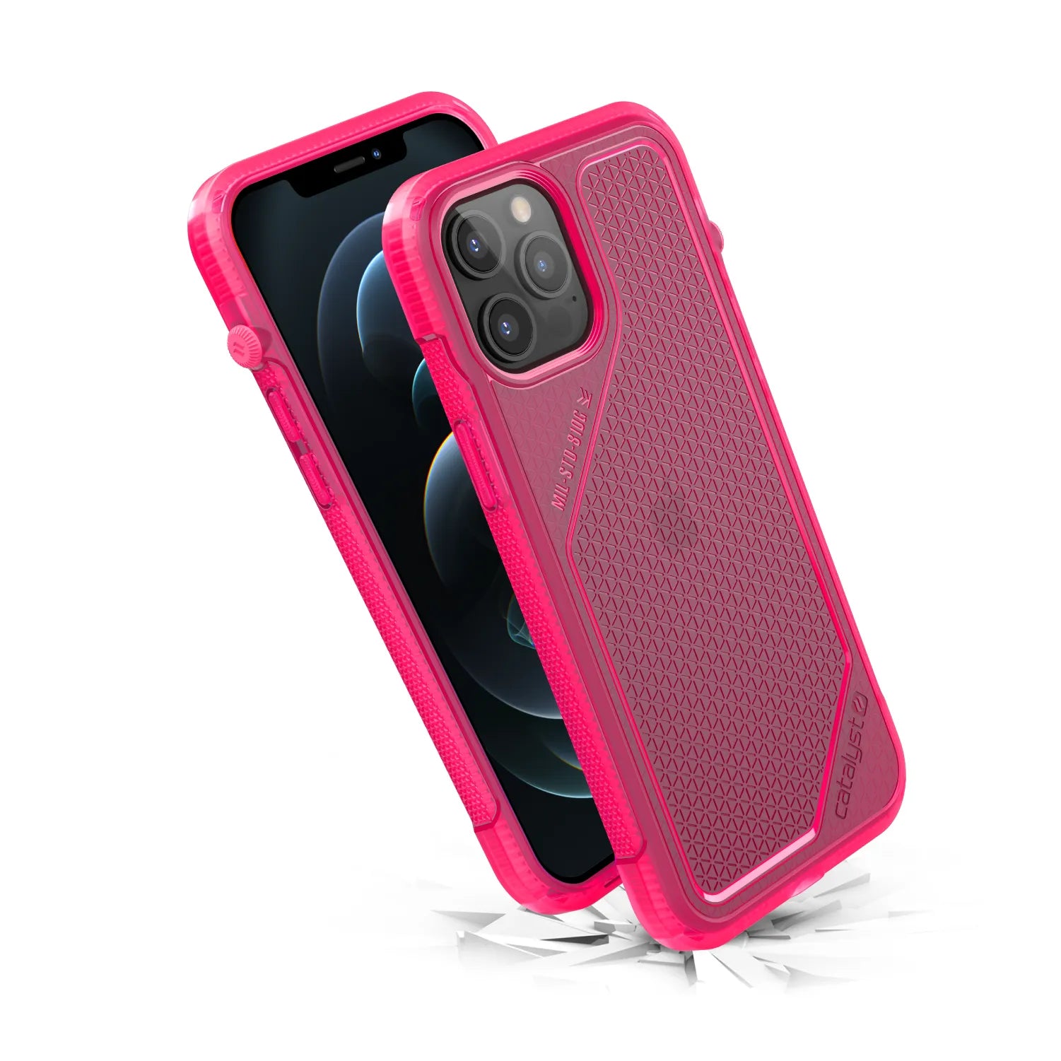 The iPhone 12 Pro Max in a vibrant pink Catalyst Vibe Case is shown with a black screen. The rugged, impact-resistant cover features a textured hexagonal pattern, reinforced corners, and bounces on cracked white to show shock absorption.