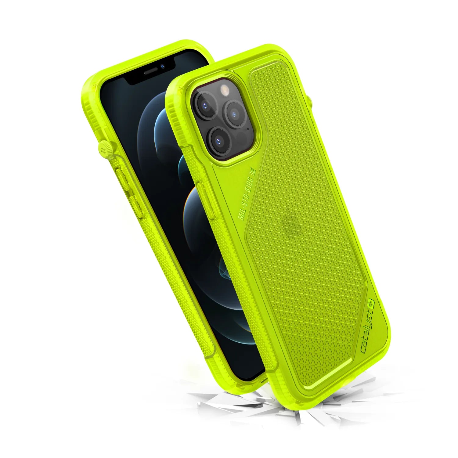 The Catalyst Case US Vibe Case for iPhone 12 Pro Max is shown in neon yellow with a rugged, hexagonal-textured design and reinforced corners, displaying both front and back views. Cracks beneath suggest drop protection; the phone screen appears black.