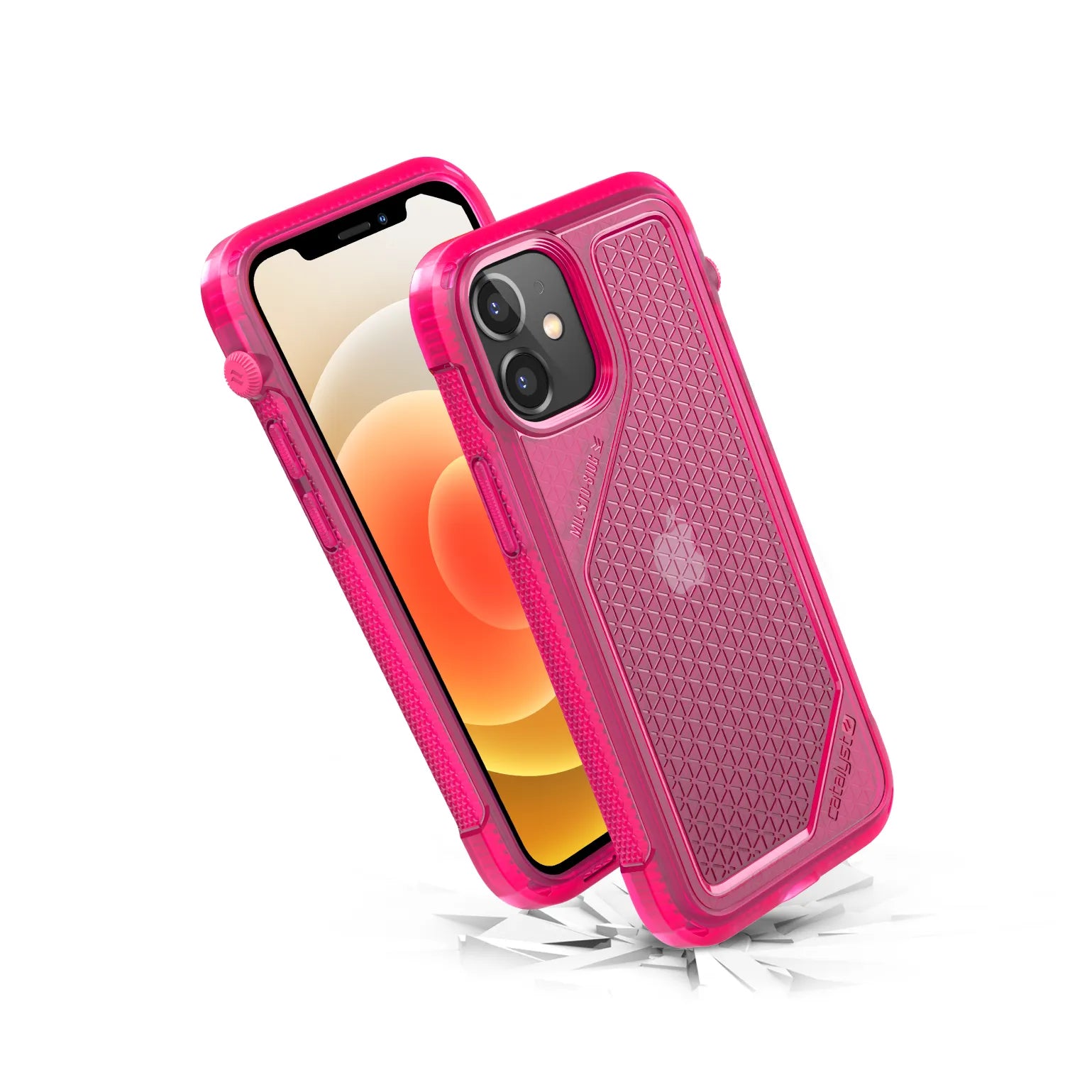Two iPhone 12 minis with yellow-orange gradient wallpapers are shown in Catalyst Case US Vibe Cases in Neon Pink. The rugged, translucent cases with geometric patterns appear impact-resistant, as suggested by cracks and debris beneath the phones.