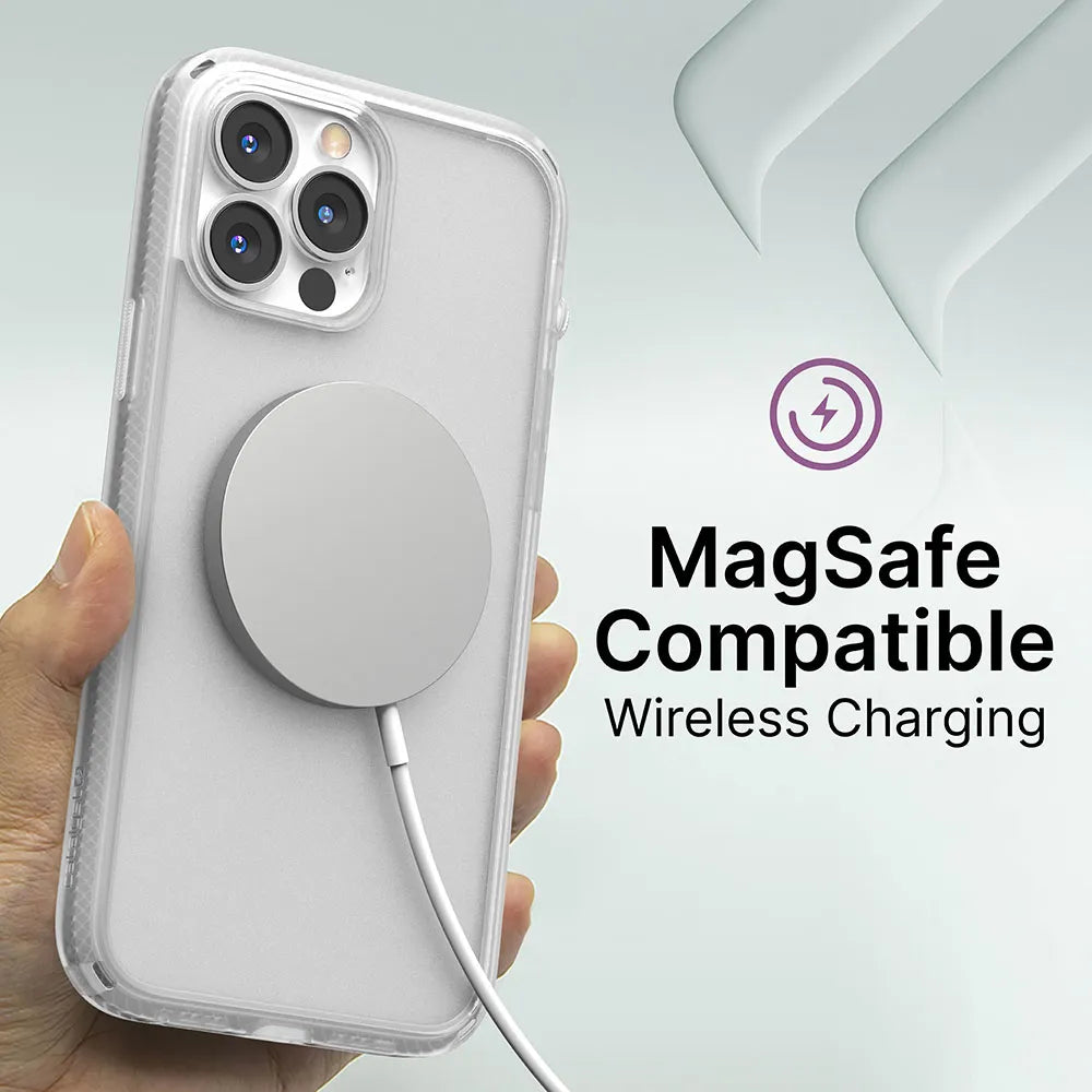 A hand holds an iPhone 13 Pro Max in a Catalyst Case US Influence Case with a MagSafe wireless charger attached. The text reads “MagSafe Compatible Wireless Charging†above a purple charging icon on a light gray abstract background.