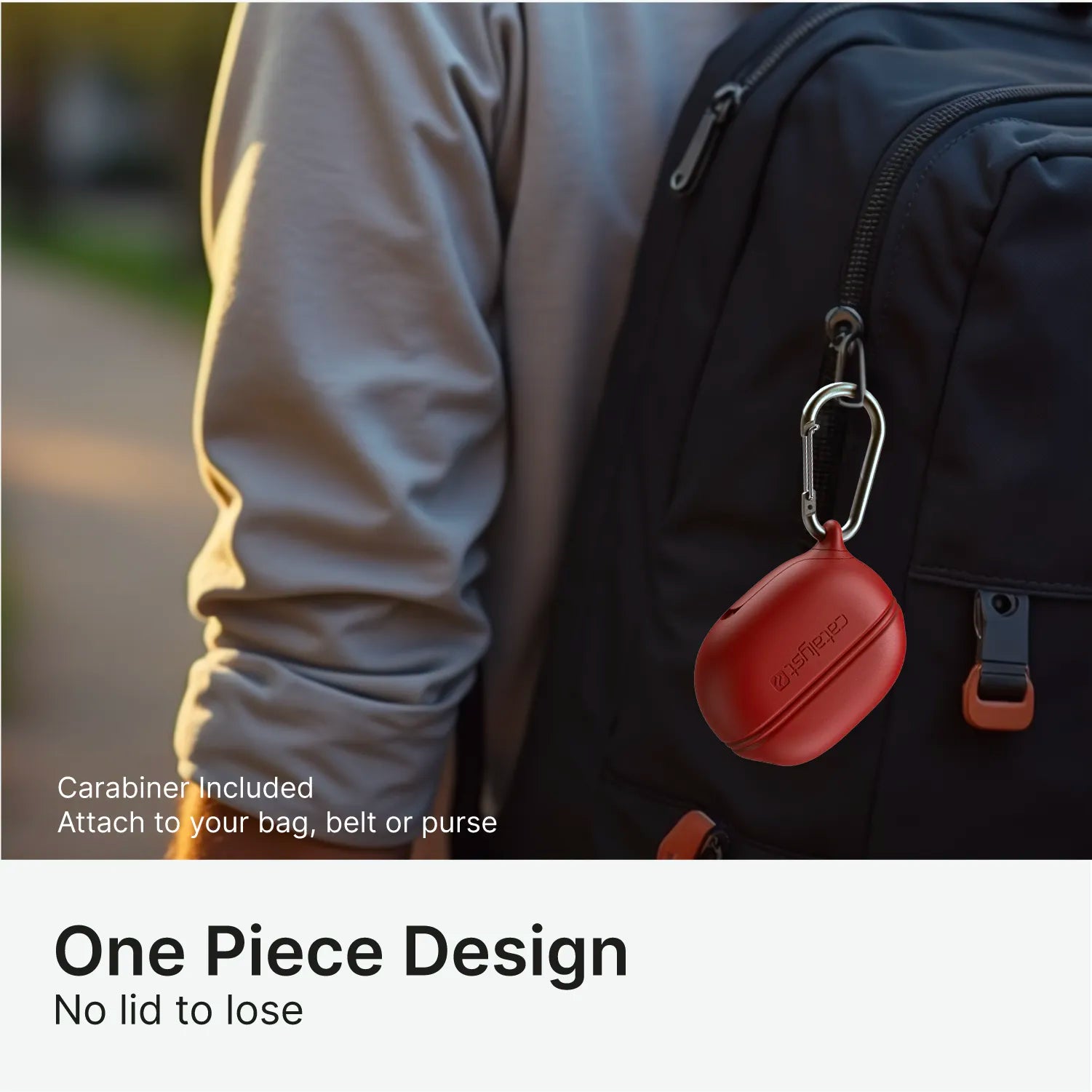A person with a gray shirt carries a black backpack. A red Catalyst Case US waterproof silicone case for Beats Studio Buds is clipped to the zipper via carabiner. Text: “Carabiner Included. Secure to your bag, belt, or purse. One-piece design—no lid to lose.”.
