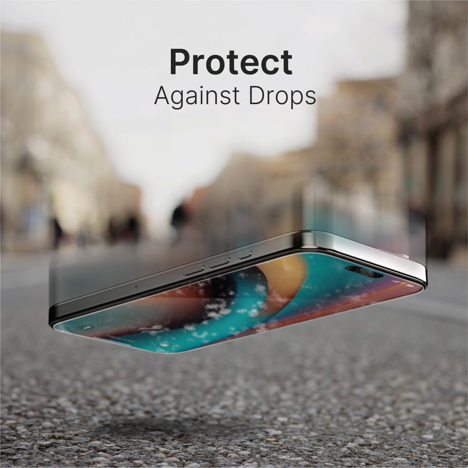 Close-up of an iPhone 16 falling on cement with the Catalyst Tempered Glass Screen Protector, featuring the text "Protect Against Drops" overlaid. Blurred street and buildings in the background.