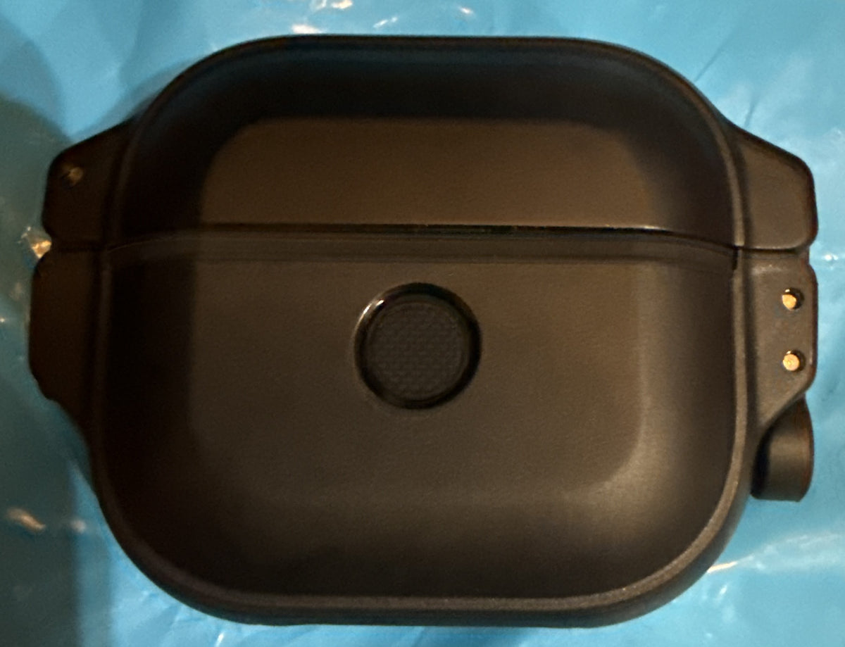 Back view of the black Catalyst Total Protection Case for AirPods (Gen 3), featuring a central circular pairing button and rugged side loops for carabiner attachment