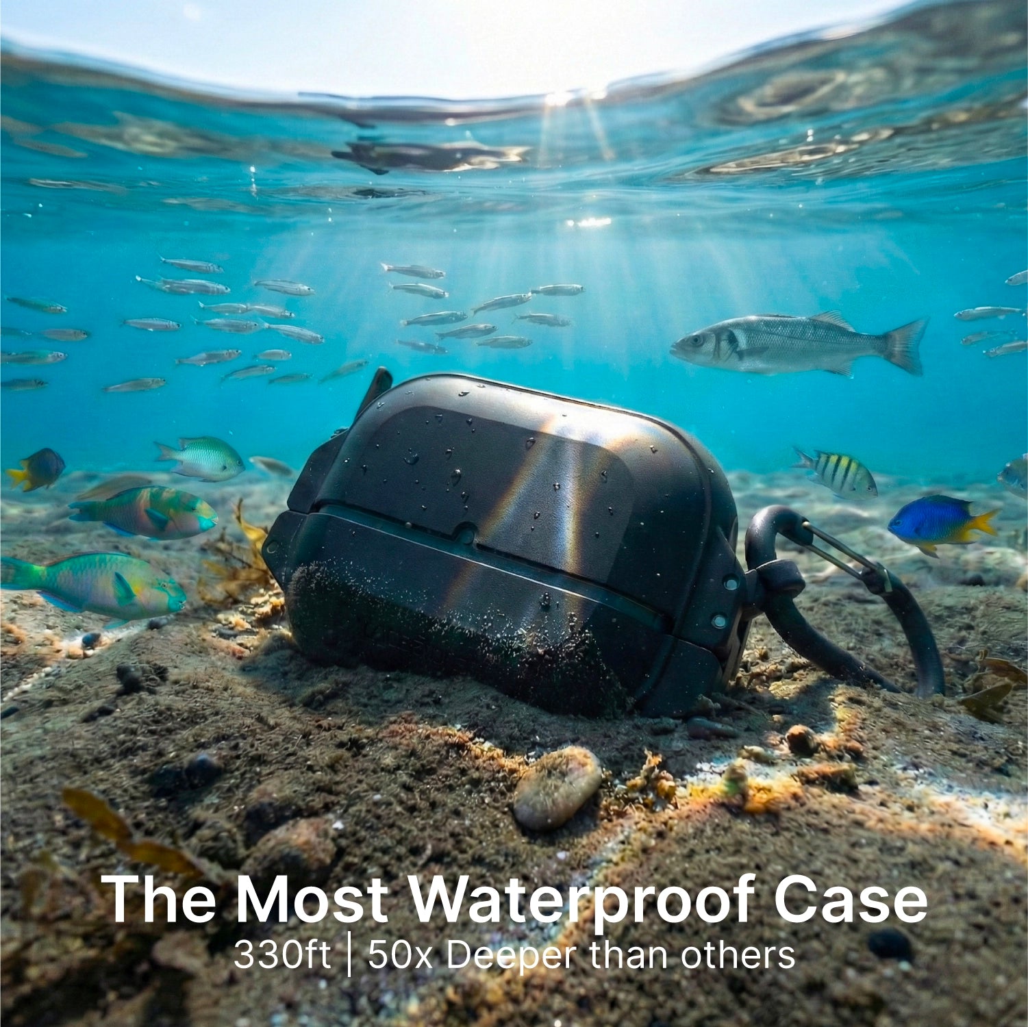 A Catalyst Case US AirPods Pro 3 - 100M Waterproof Total Protection Case + Carabiner lies on the ocean floor among fish and coral under sunlight. Text: "The Most Waterproof Case. 330ft | 50x Deeper than others.