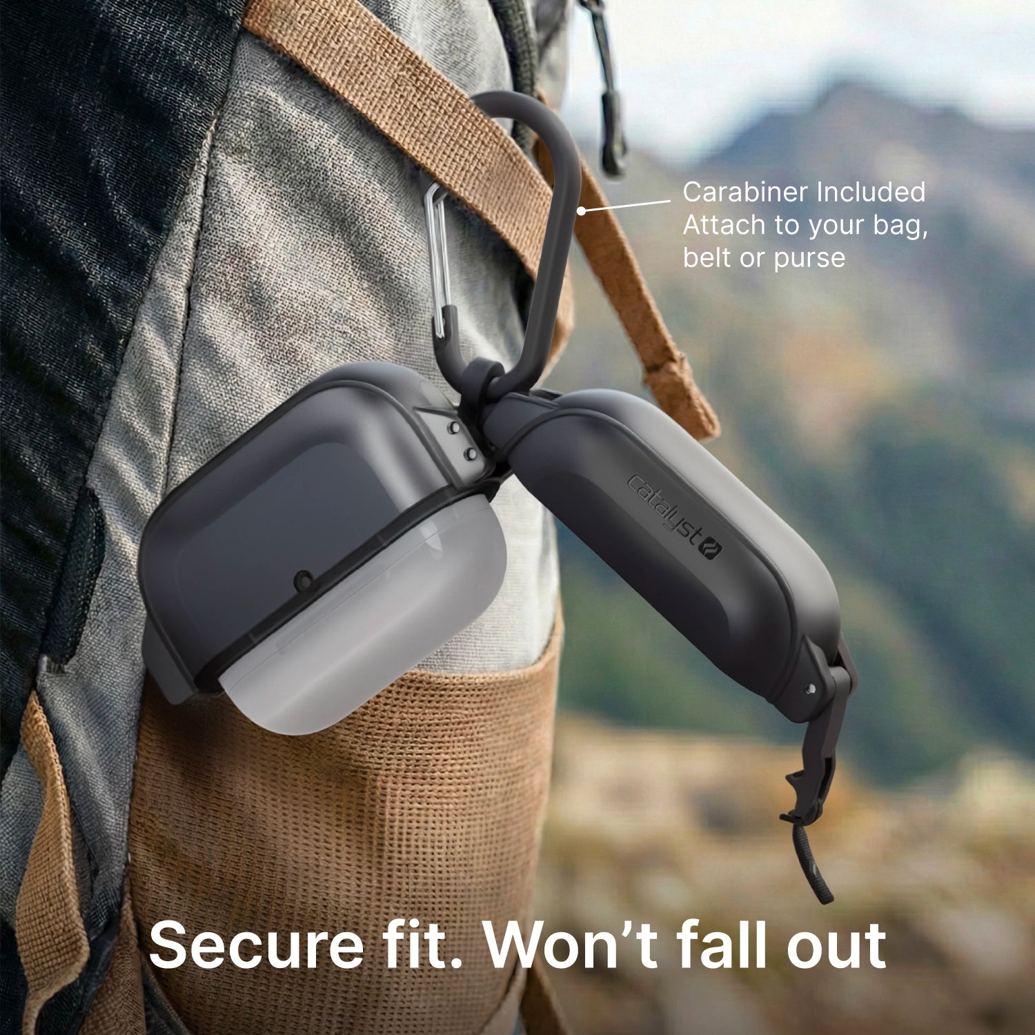 A Catalyst Case US AirPods Pro 3 – 100M Waterproof Total Protection Case + Carabiner is clipped to a backpack outdoors with mountains in the background. Image text: “Carabiner Included” and “Secure fit. Won’t fall out.” Military-grade drop protection.