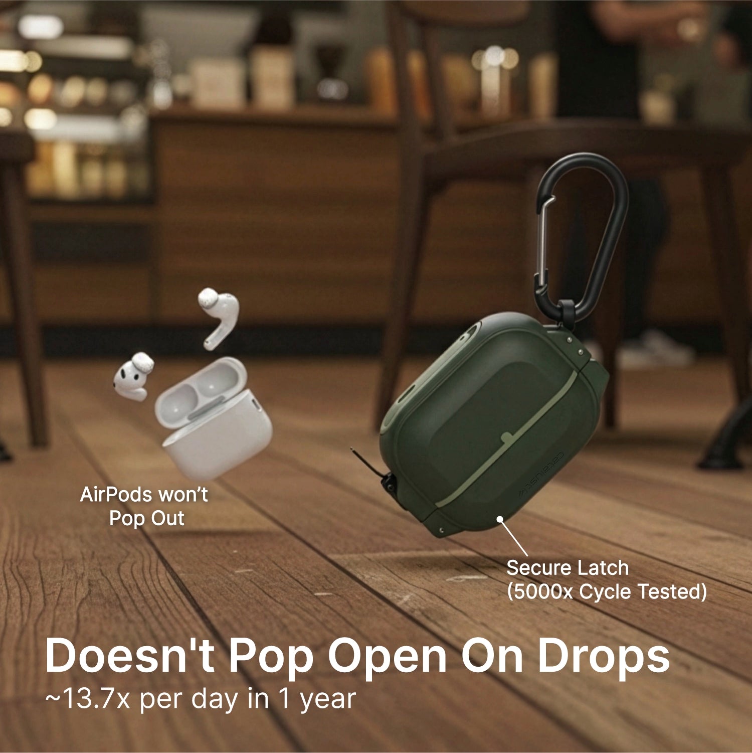 A Catalyst Case US AirPods Pro 3 - 100M Waterproof Total Protection Case + Carabiner in green sits on a café floor, with AirPods flying from a regular case. Text: “AirPods won’t Pop Out” and “Secure Latch – cycle tested for durability.”.