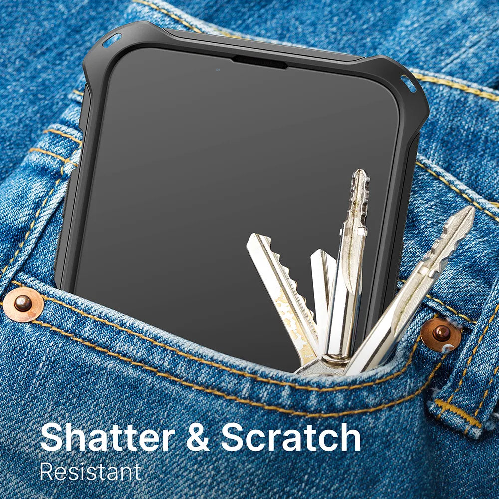 The iPhone 14 Plus with a Catalyst Case US tempered glass screen protector is shown in the front pocket of blue jeans next to metal keys, highlighting the protector’s durable, shatter- and scratch-resistant design.