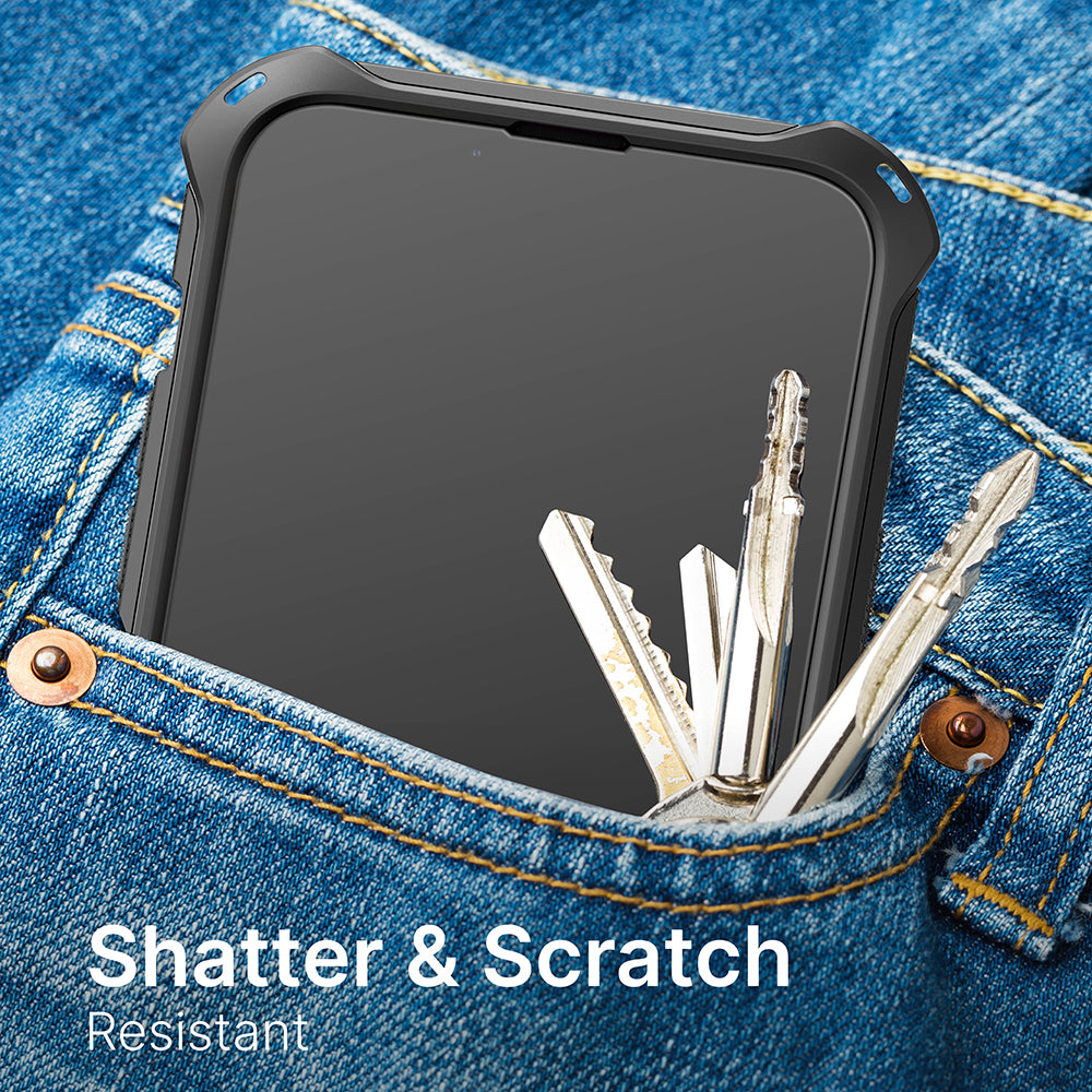 An iPhone 14 Pro Max with a Catalyst Case US tempered glass screen protector rests in a denim jeans pocket next to metal keys. The image text, "Shatter & Scratch Resistant," emphasizes its strong, reliable protection.