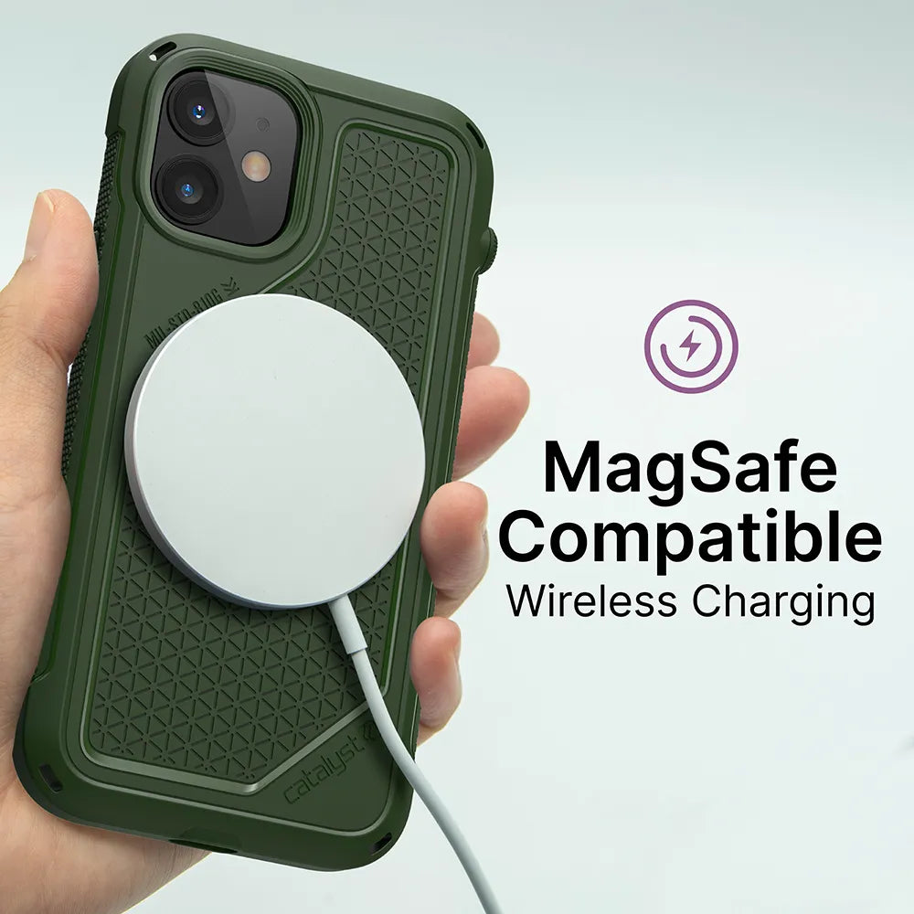 A hand holds an iPhone 12 mini in a green Catalyst Case US Vibe Case with a white MagSafe wireless charger attached. Beside it, “MagSafe Compatible Wireless Charging” appears with a purple charging icon above.