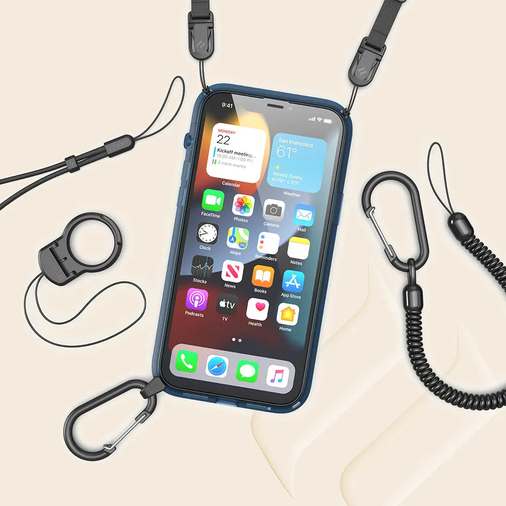 An iPhone 13 Pro in a blue Catalyst Case US Influence Case features drop protection, a black lanyard, and carabiner clips. The screen is vibrant, while extra accessoriesÃƒÂ¢Ã¢â€šÂ¬Ã¢â‚¬Âlanyard, clip, and adjustable wrist strapÃƒÂ¢Ã¢â€šÂ¬Ã¢â‚¬Âlie on a beige background.